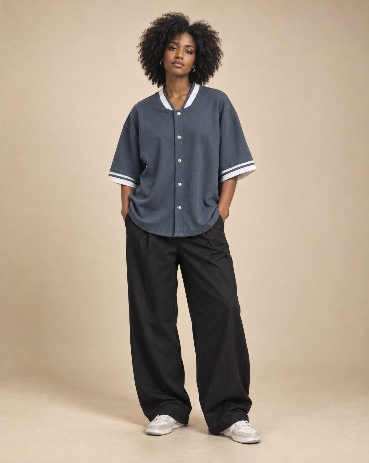 Female model wearing SHOPHOODIE BLANK Boxy Heavyweight Baseball Jersey, studio shot