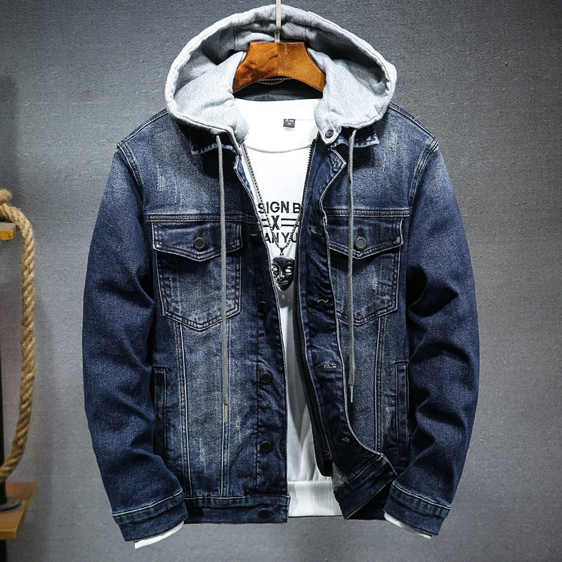 Denim jacket with gray hood on a gray background