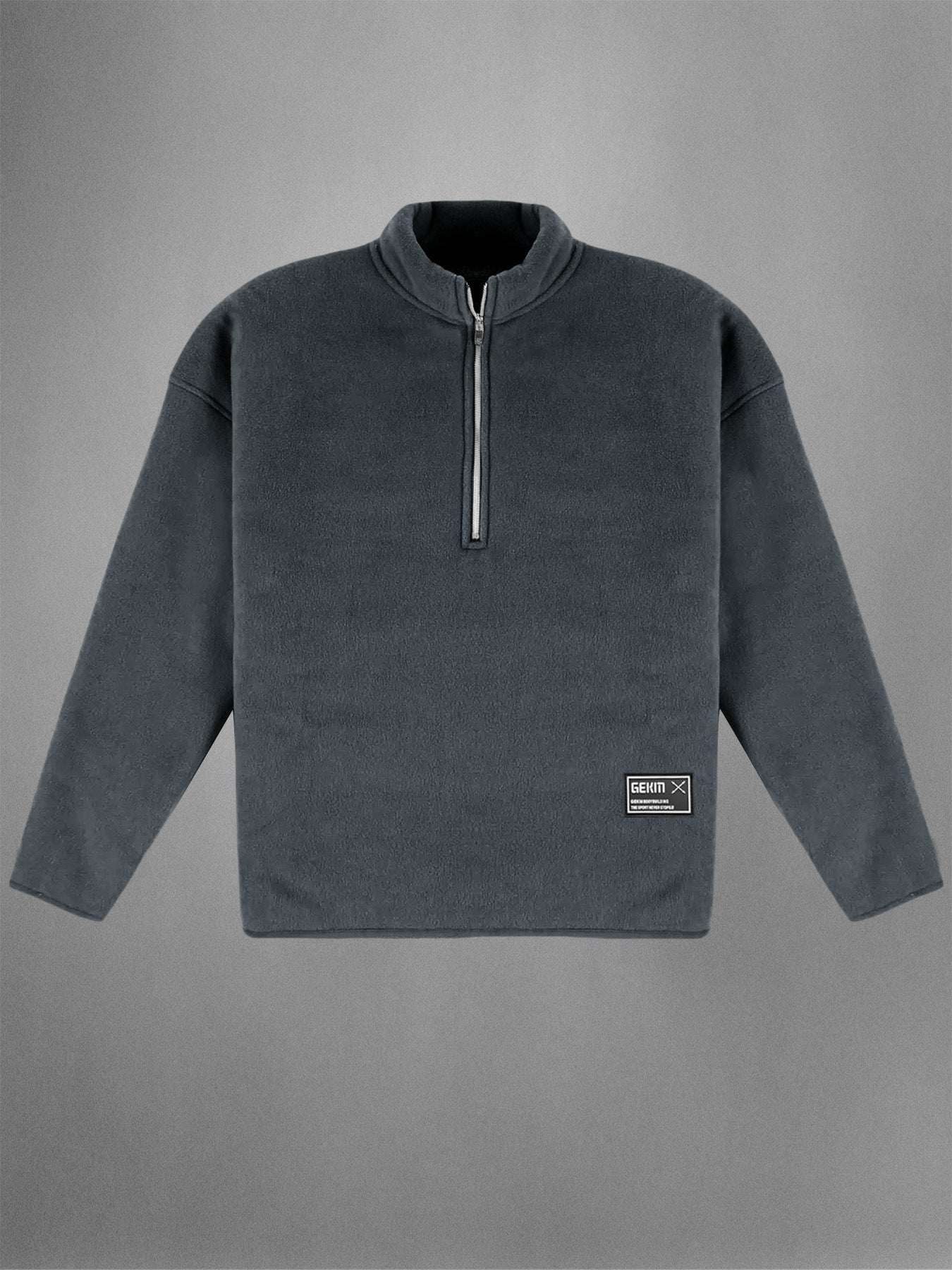 Gray fleece pullover with a quarter zip on a gray background