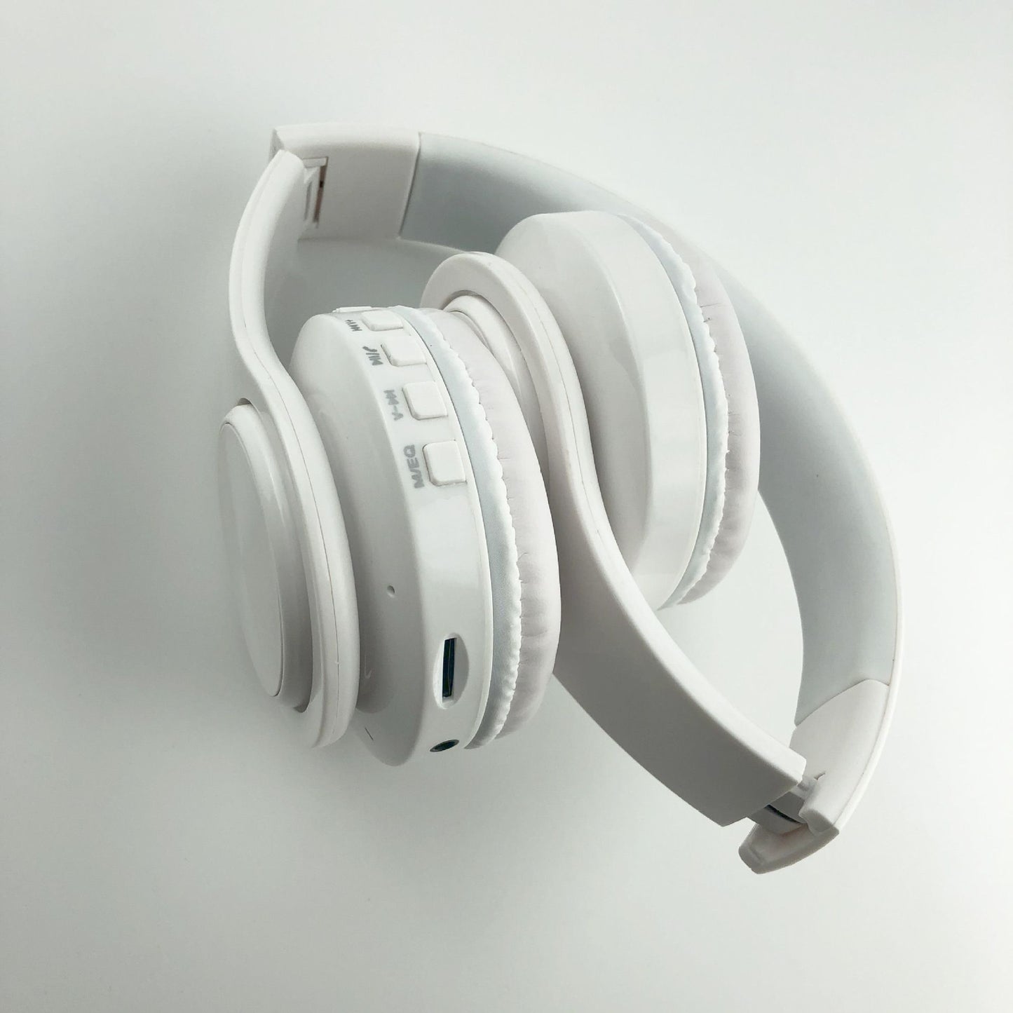 White headphones on a light gray background