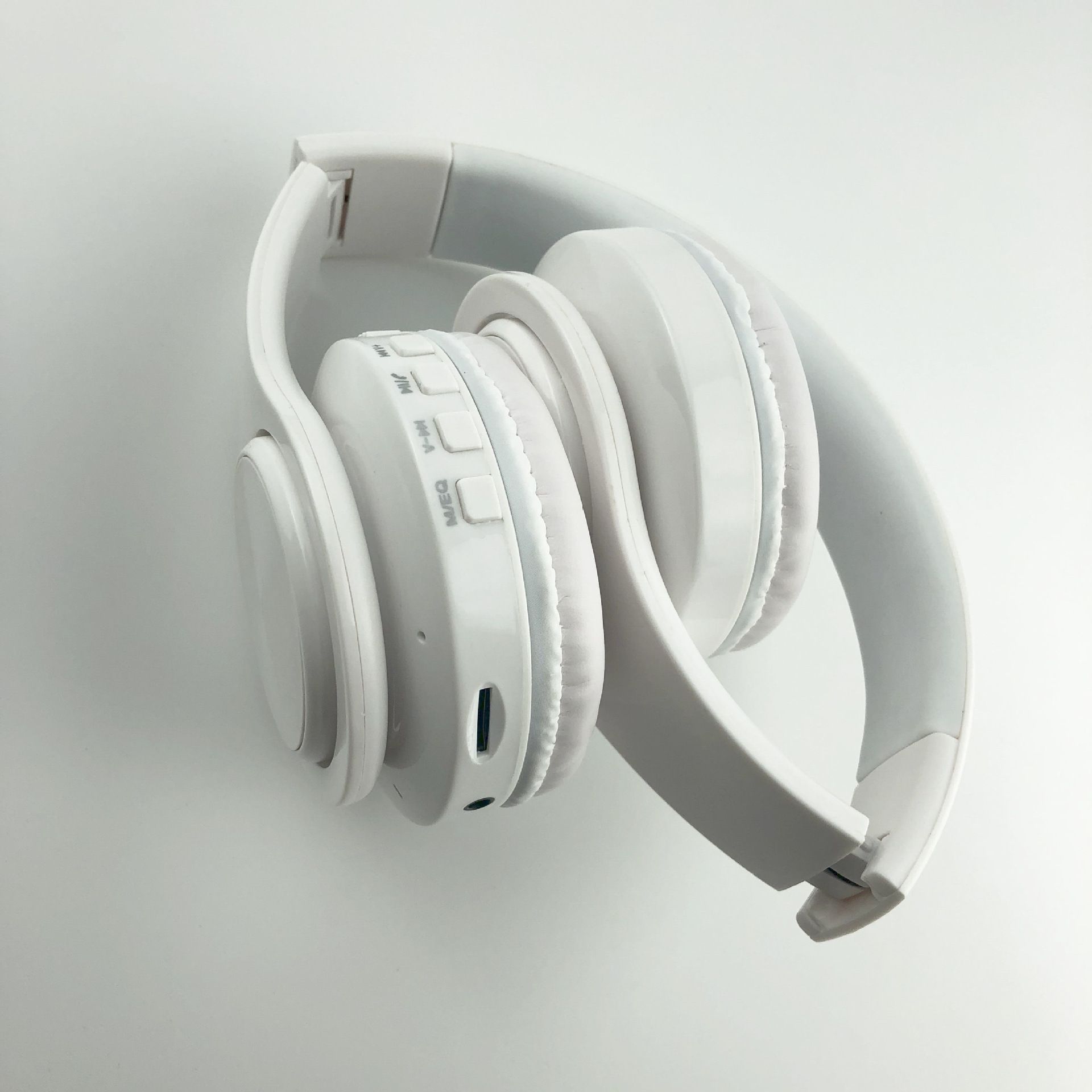 White headphones on a light gray background