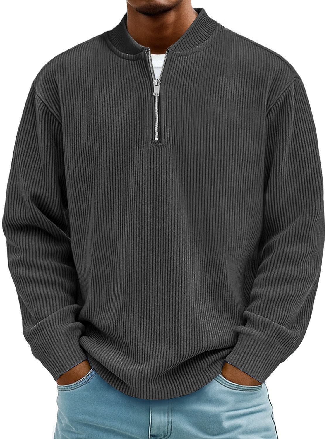 Man wearing a gray ribbed sweater with a zipper on a white background