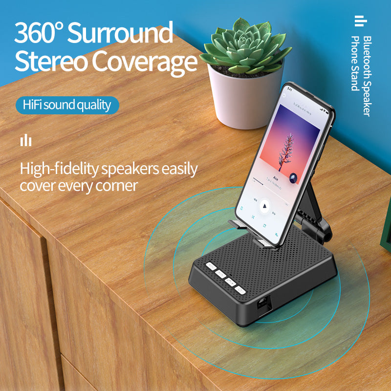 Phone stand with Bluetooth speaker on a wooden surface, featuring text about 360-degree stereo coverage.