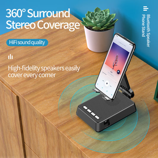 Phone stand with Bluetooth speaker on a wooden surface, featuring text about 360-degree stereo coverage.
