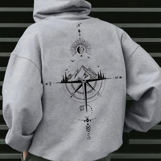 Gray hoodie with a mountain and compass design on the back against a striped background