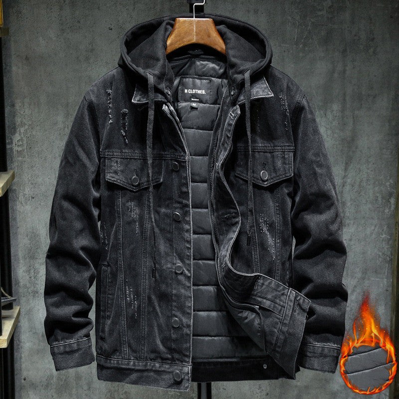 Black denim jacket with quilted lining on a gray background