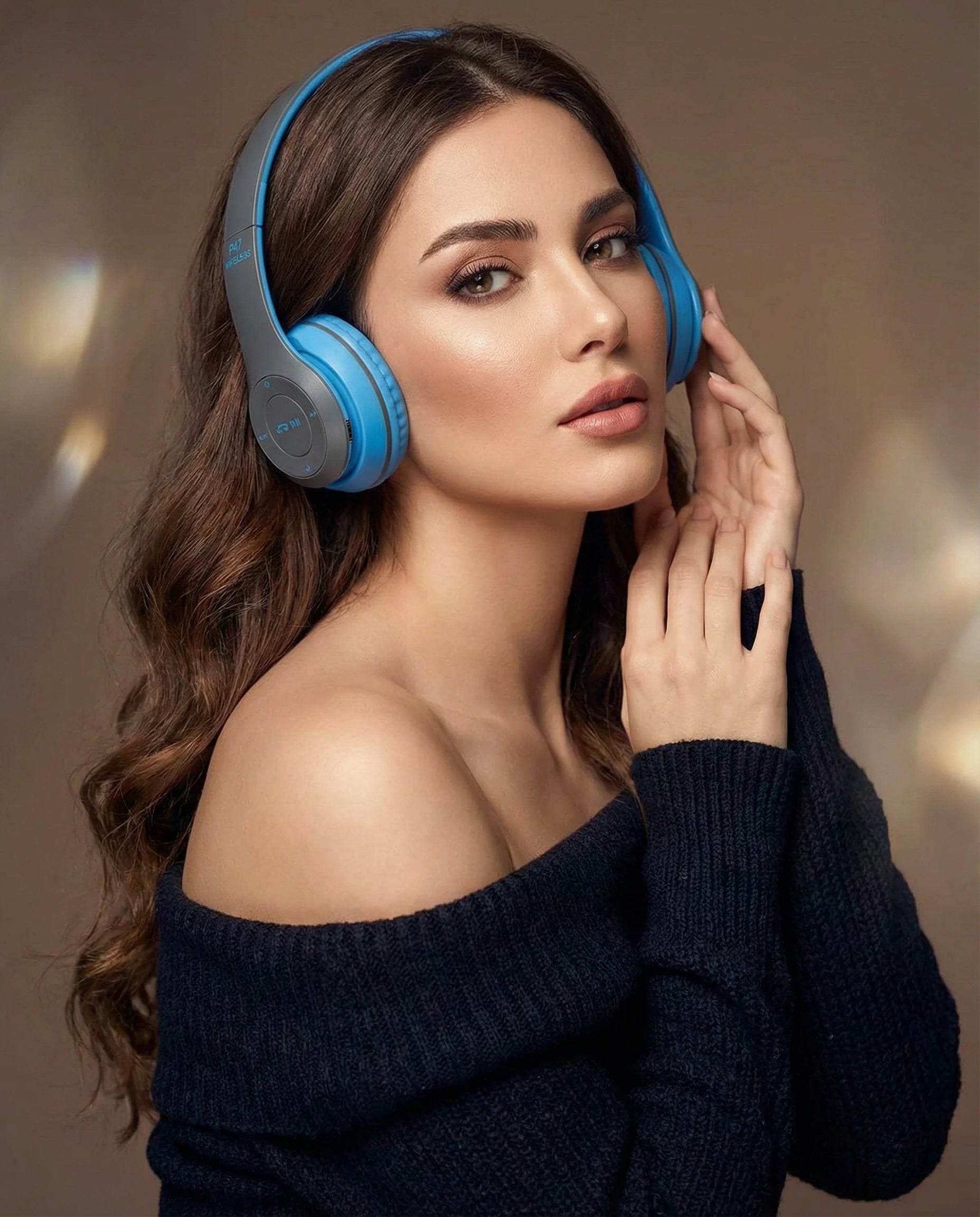 Woman wearing blue headphones with a blurred background