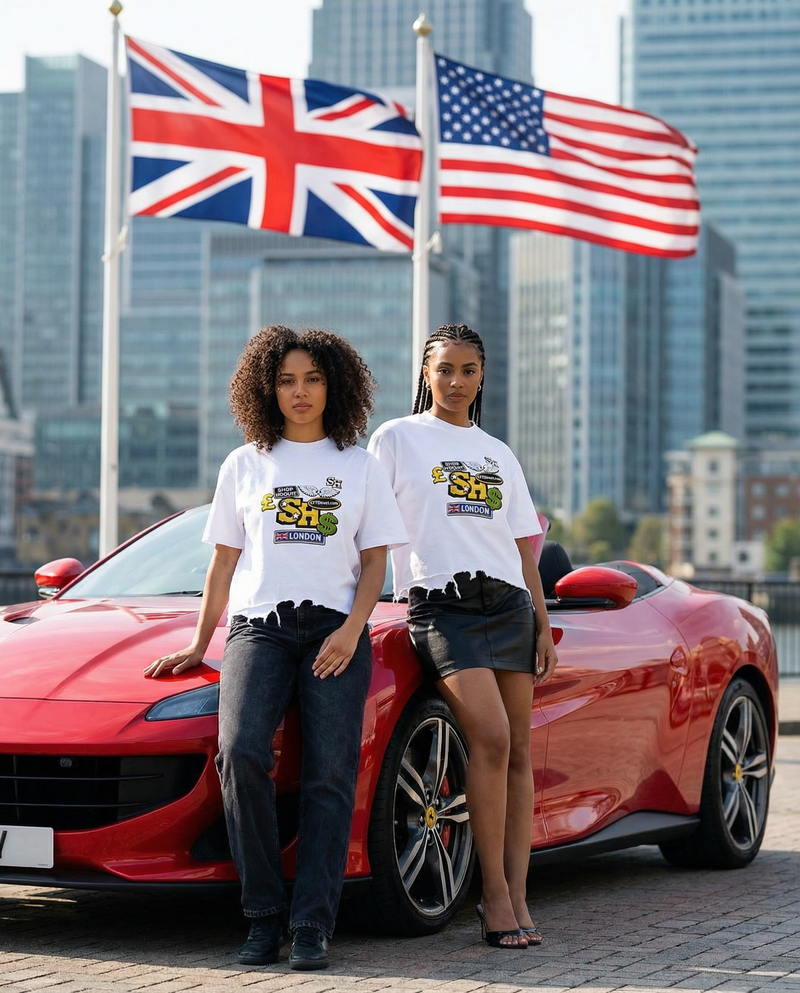 Two women standing next to a red sports car with flags in the background ShopHoodie™