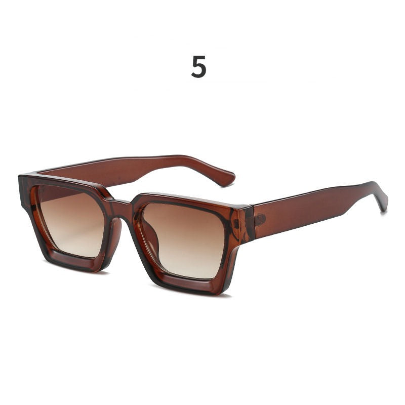 Brown sunglasses with a gradient lens on a white background