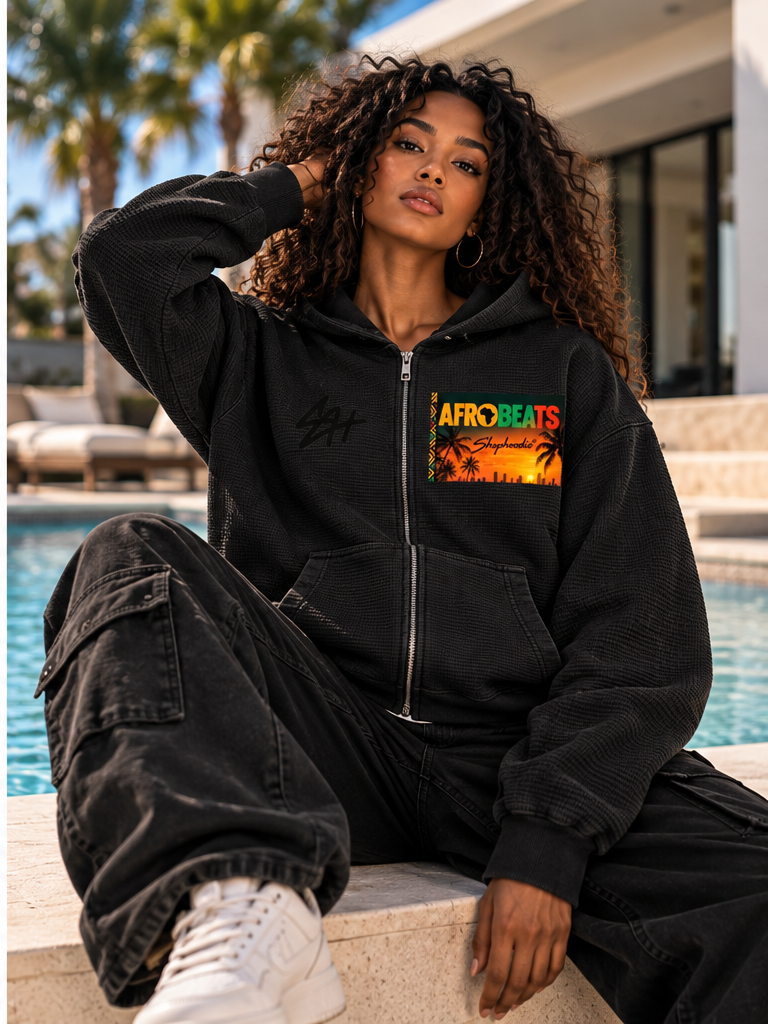 Female model wearing SHOPHOODIE AFROBEATS SH black waffle zip hoodie