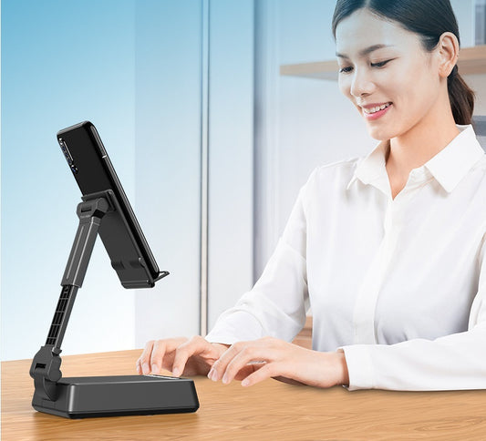 Woman using a tablet stand at a desk with a blurred background