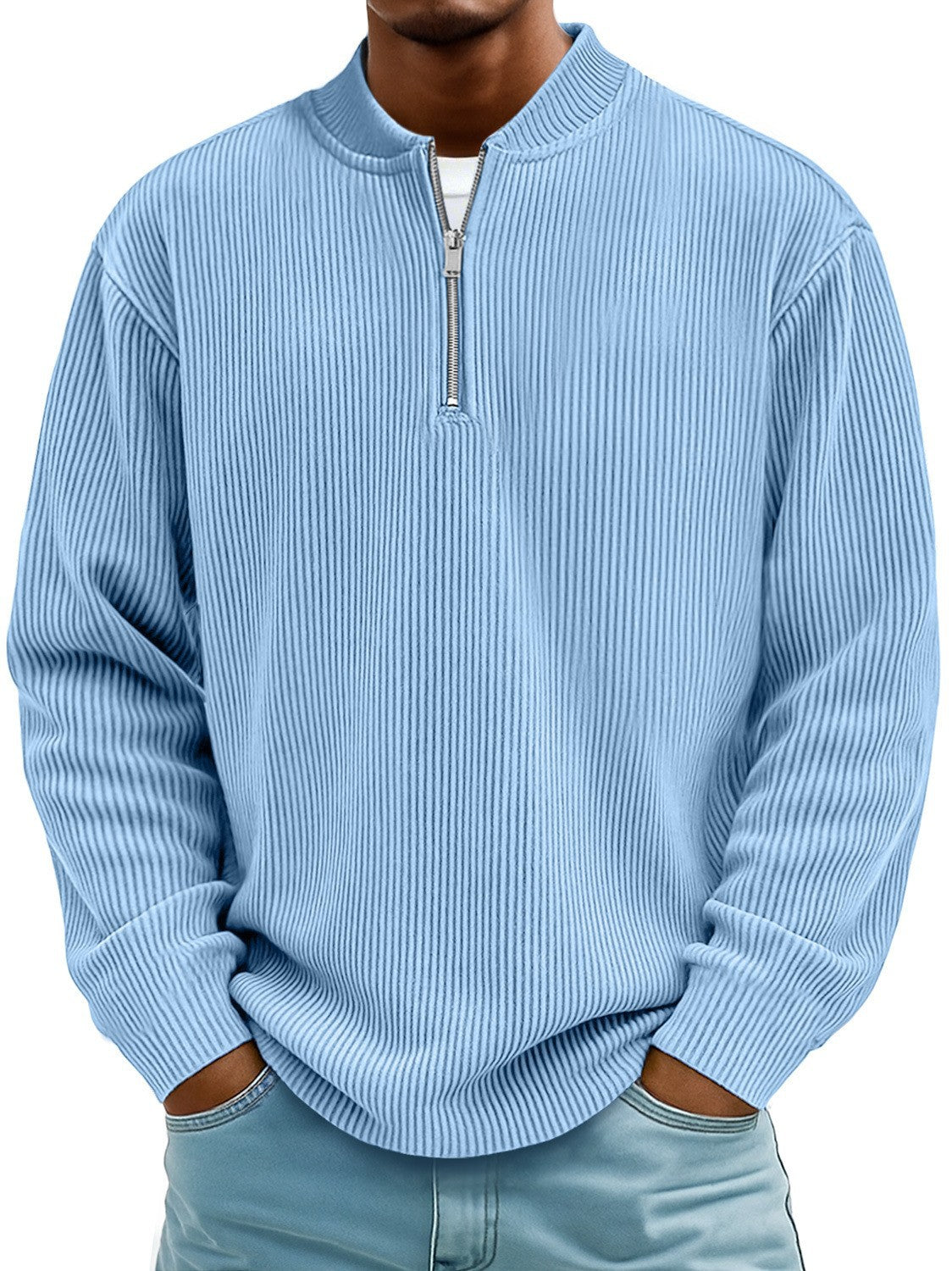 Light blue ribbed sweater worn by a person on a white background