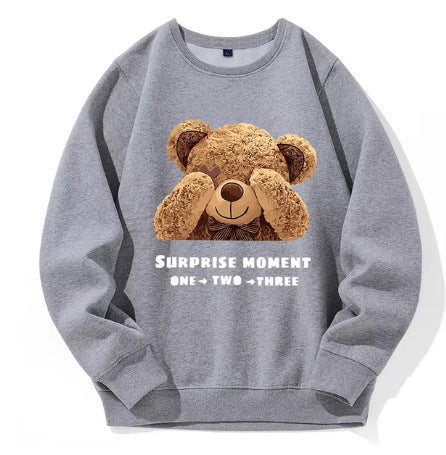 Gray sweatshirt with a teddy bear graphic and text on a white background