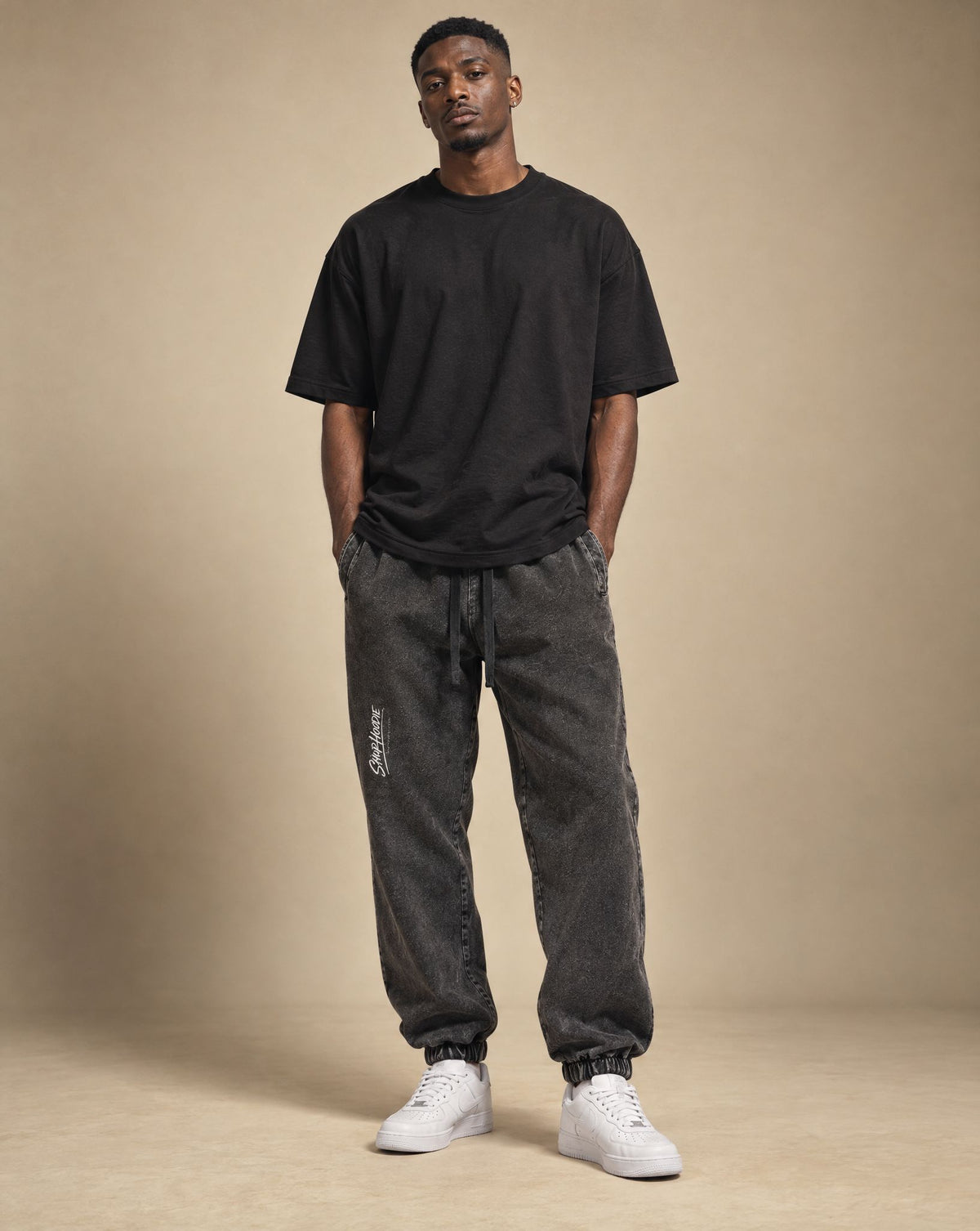 Male model wearing SHOPHOODIE Jogged Sweatpants 380 GSM, studio shot