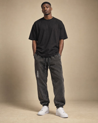 Male model wearing SHOPHOODIE Jogged Sweatpants 380 GSM, studio shot