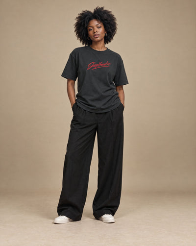 Female model wearing SHOPHOODIE Men's Performance Regular Fit T-Shirt — 180 GSM, studio shot