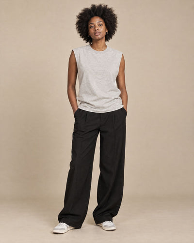 Female model wearing SHOPHOODIE BLANK Raw Edge Cotton Tank Top, studio shot