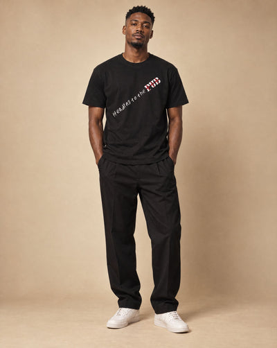 Male model wearing SHOPHOODIE HEADING TO THE PUB BRITISH ENGLAND Pure Cotton Unisex T-Shirt — 180 GSM, studio shot