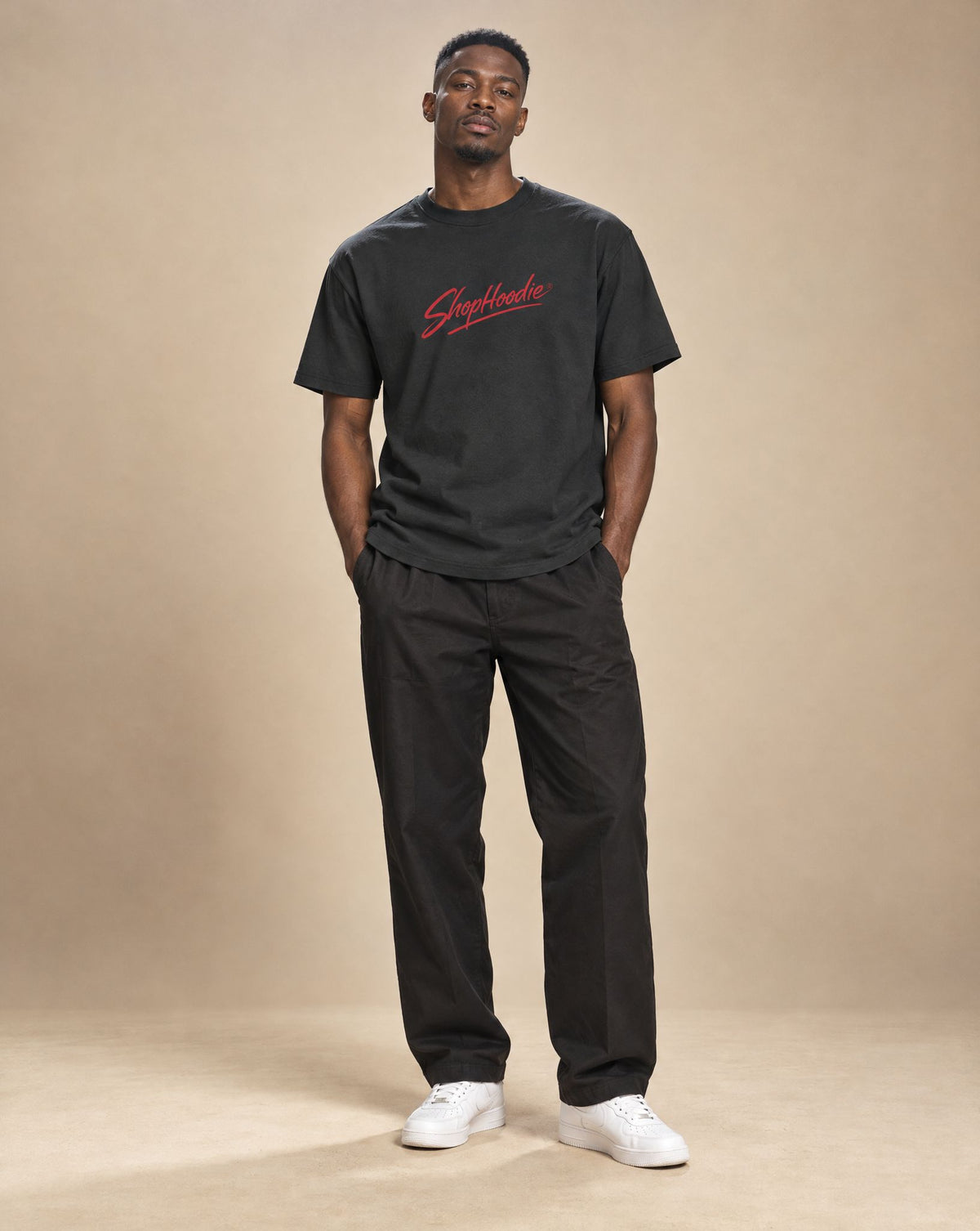 Kwame wearing SHOPHOODIE® Men's Performance Regular Fit T-Shirt — 180 GSM